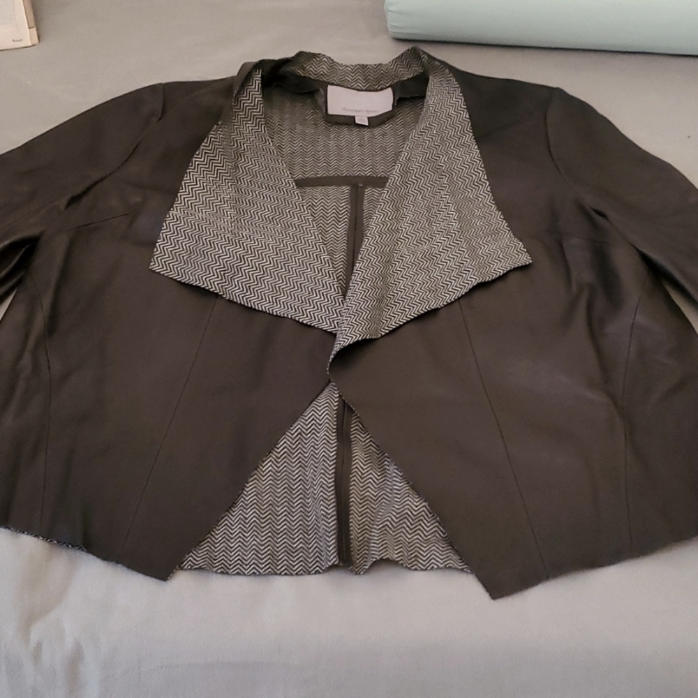 NWOT short leather jacket size L. Perfectly gorgeous